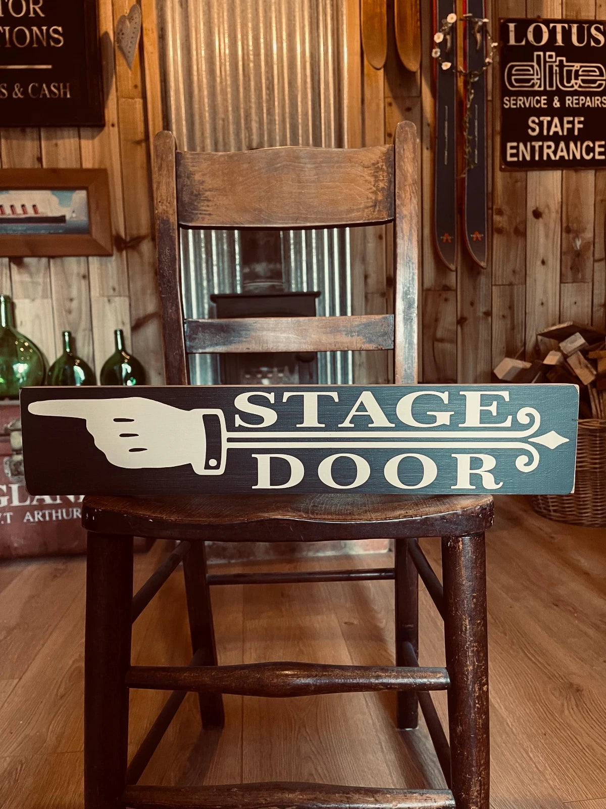 stage door with pointing hand vintage style wooden sign